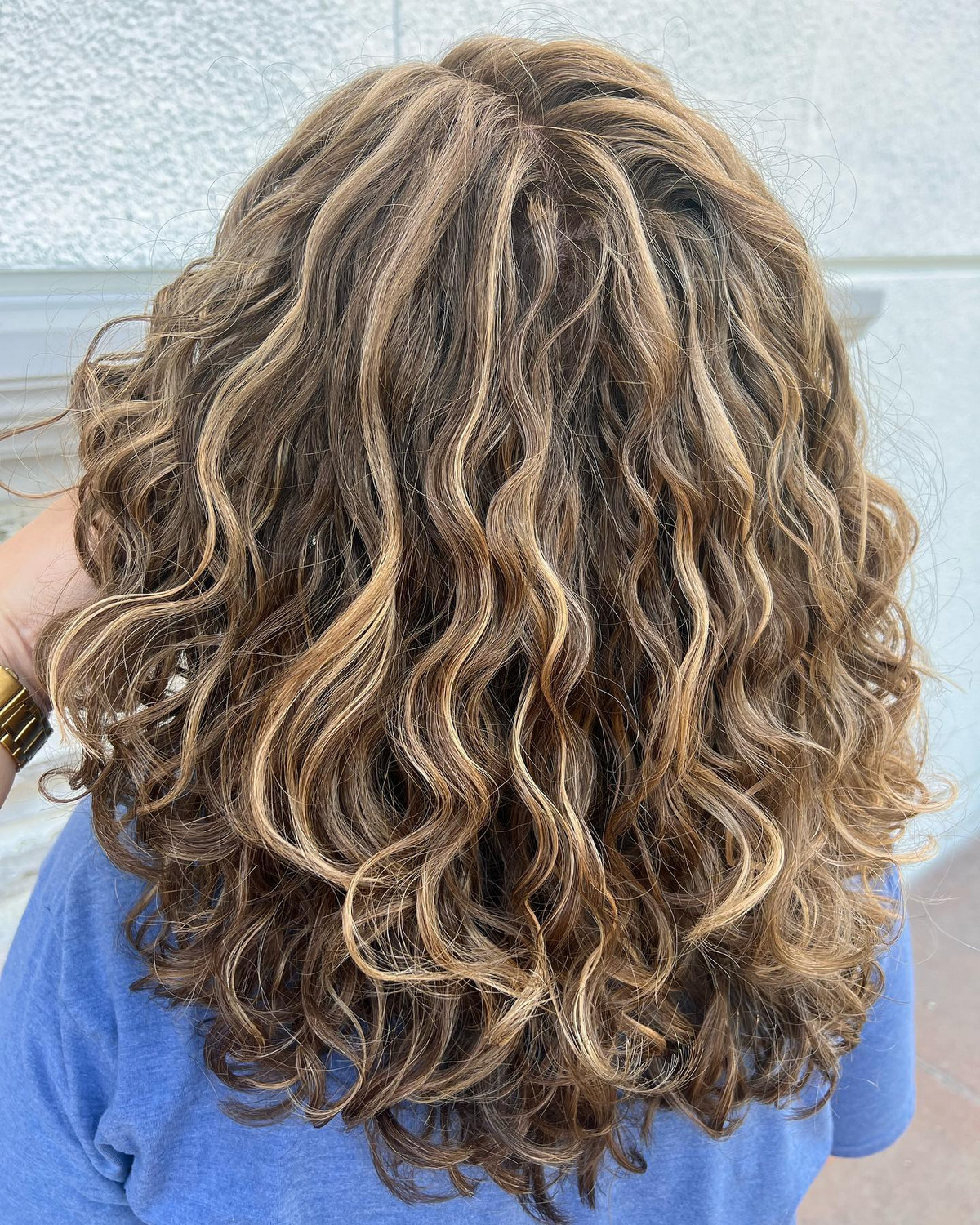 curly brown hair with blonde tips